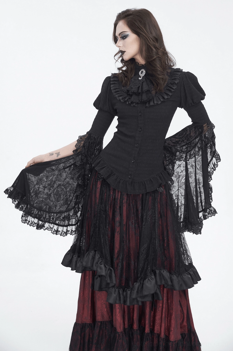 Gothic black lace blouse model shot showing dramatic ruffled neckline and overall silhouette