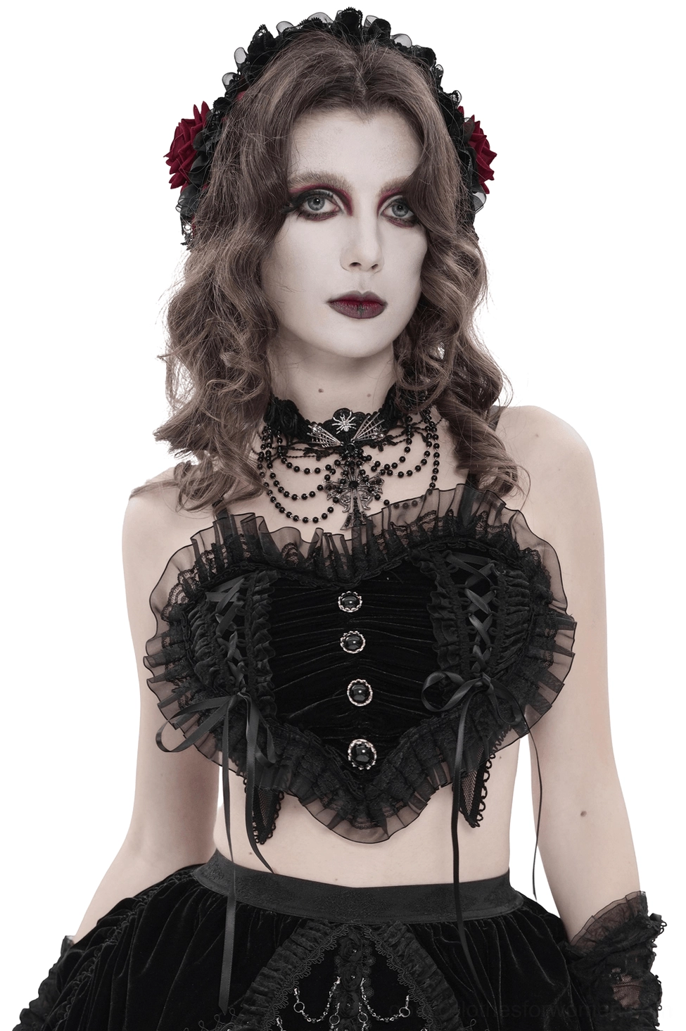 Black gothic lace crop top with ruffle trim worn by female model, front view showing heart-shaped lace-up details and ruched front