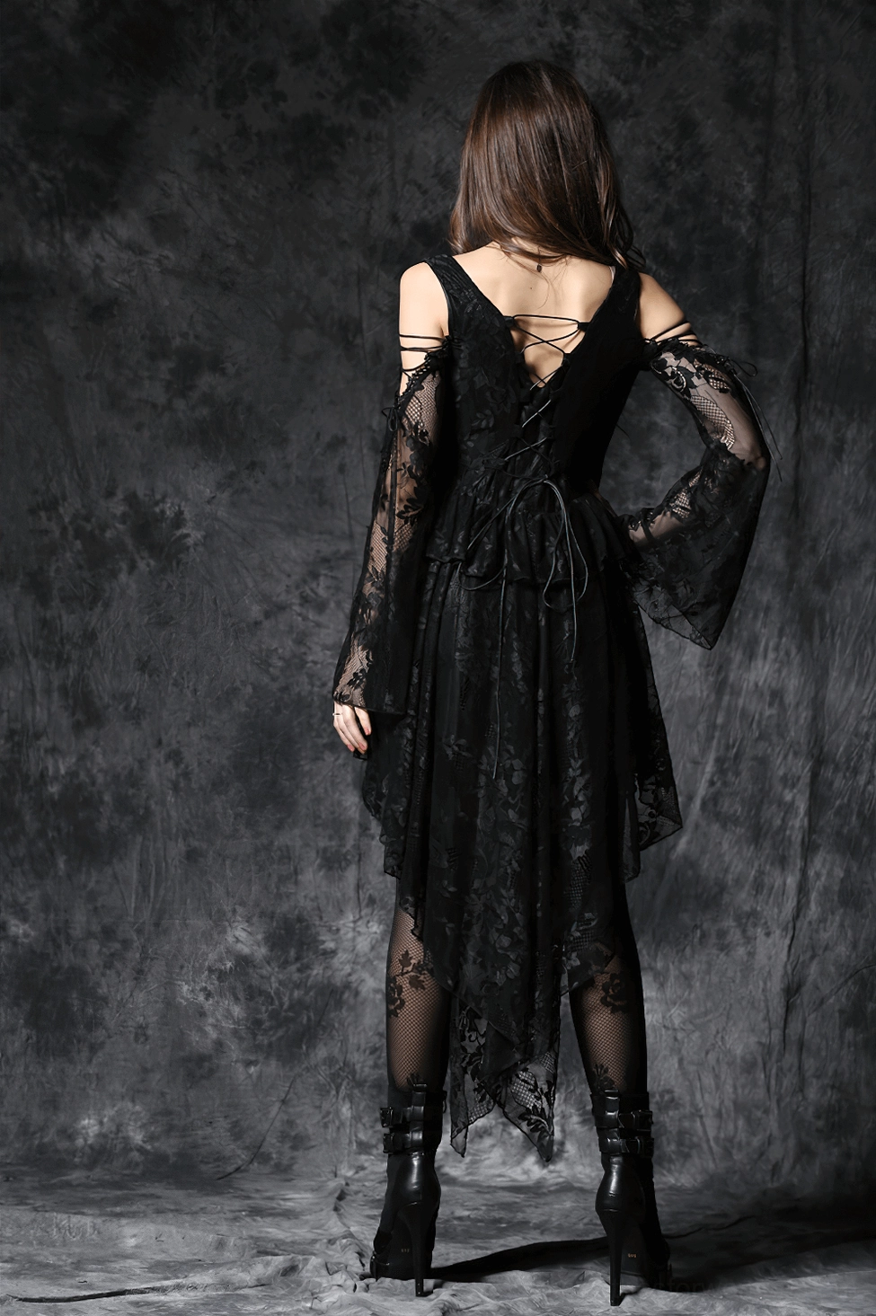 Gothic lace dress back view highlighting lace-up corset closure and long flared sleeve design