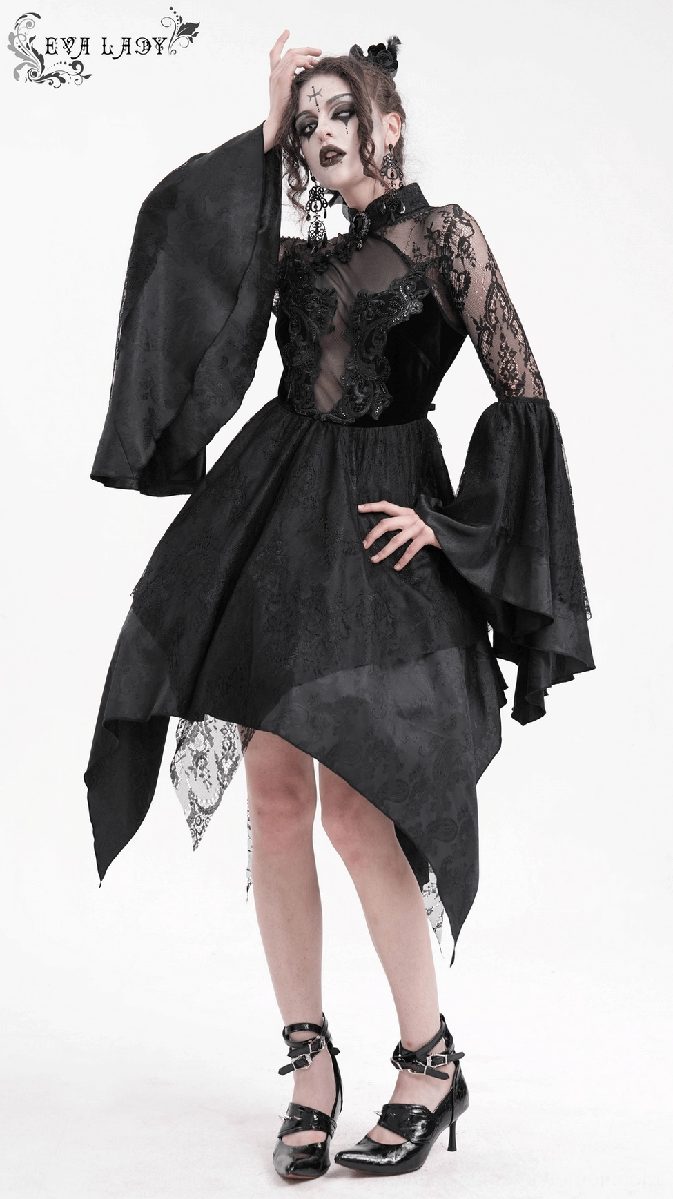 Black gothic lace dress close-up of damask floral lace pattern and sheer mesh overlay composition