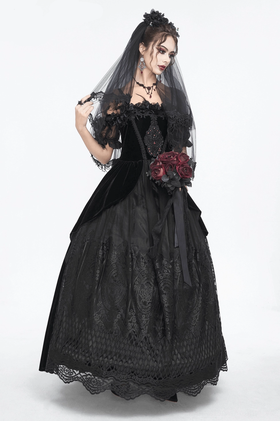 Black gothic lace dress sleeve detail - feather and lace trim creating dramatic short sleeve design