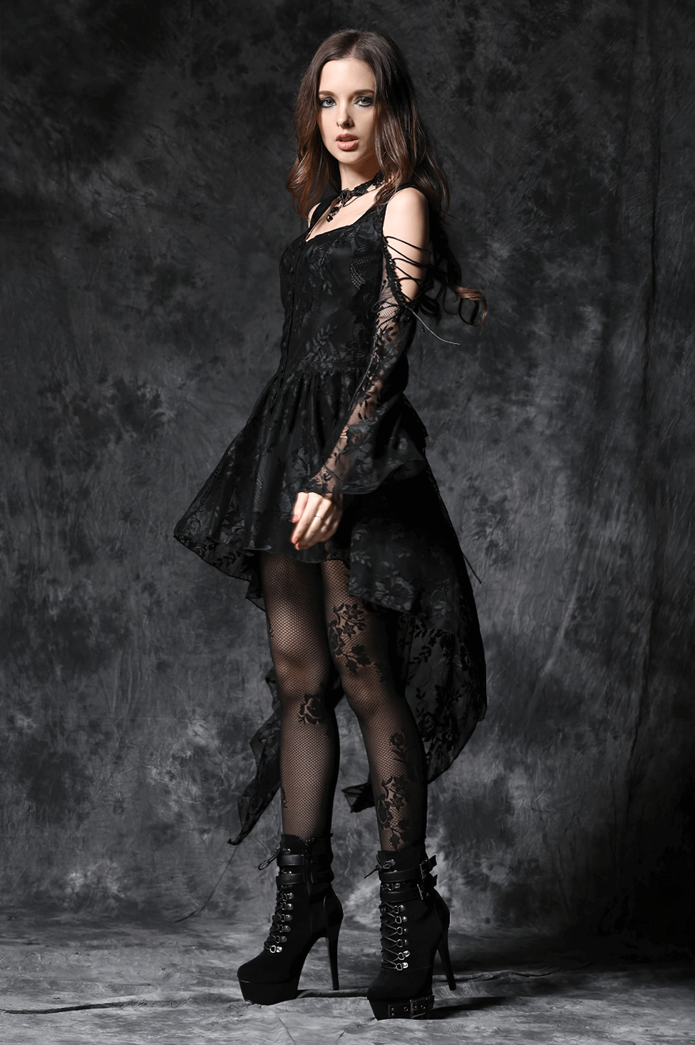 Black gothic off-shoulder lace dress detail shot showcasing intricate lace pattern and fabric texture