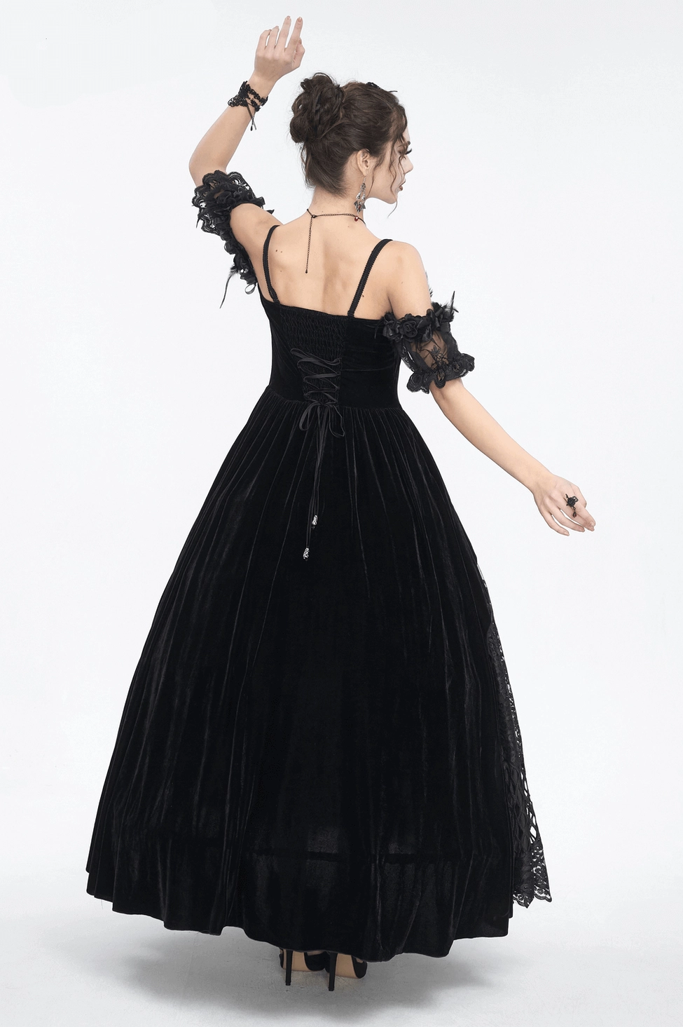 Black gothic lace formal gown detail shot - showing intricate lace work and gothic design elements