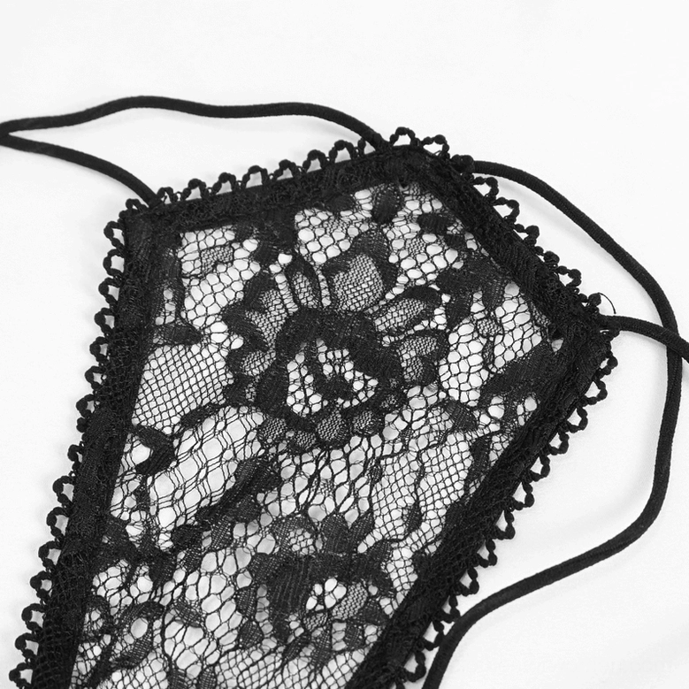 Close-up texture of black floral lace lingerie fabric scalloped edges elastic straps