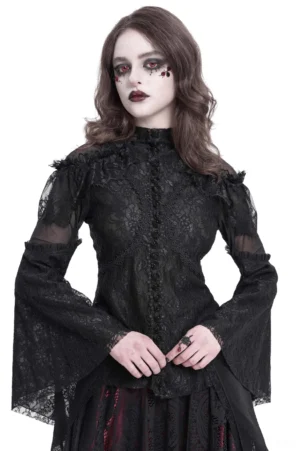 Black gothic lace long sleeve top with ruffled shoulders and high collar, modeled by female with gothic makeup in studio setting, front three-quarter view showcasing split bell sleeves and sheer mesh panels