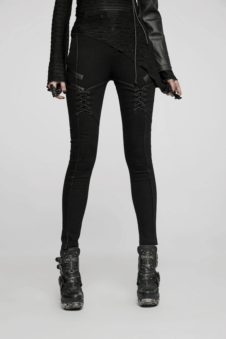 Black gothic lace-up skinny jeans fit demonstration, showing how fitted silhouette flatters the body on women's alternative fashion piece