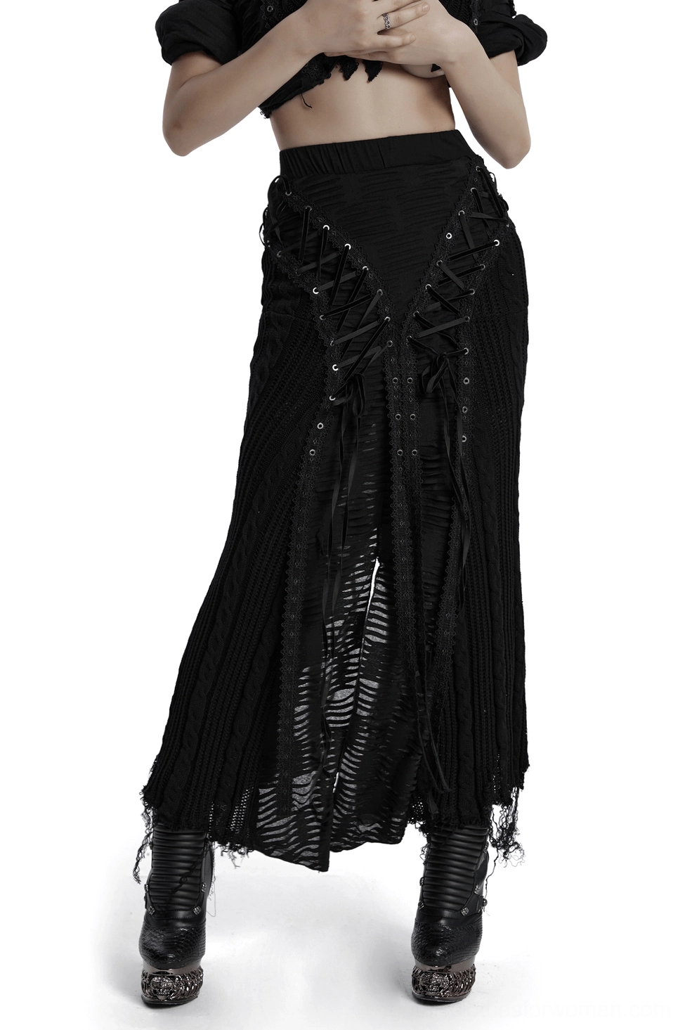 Black distressed gothic lace-up knit maxi skirt front three-quarter view with asymmetric frayed hem and lace-up details on female model