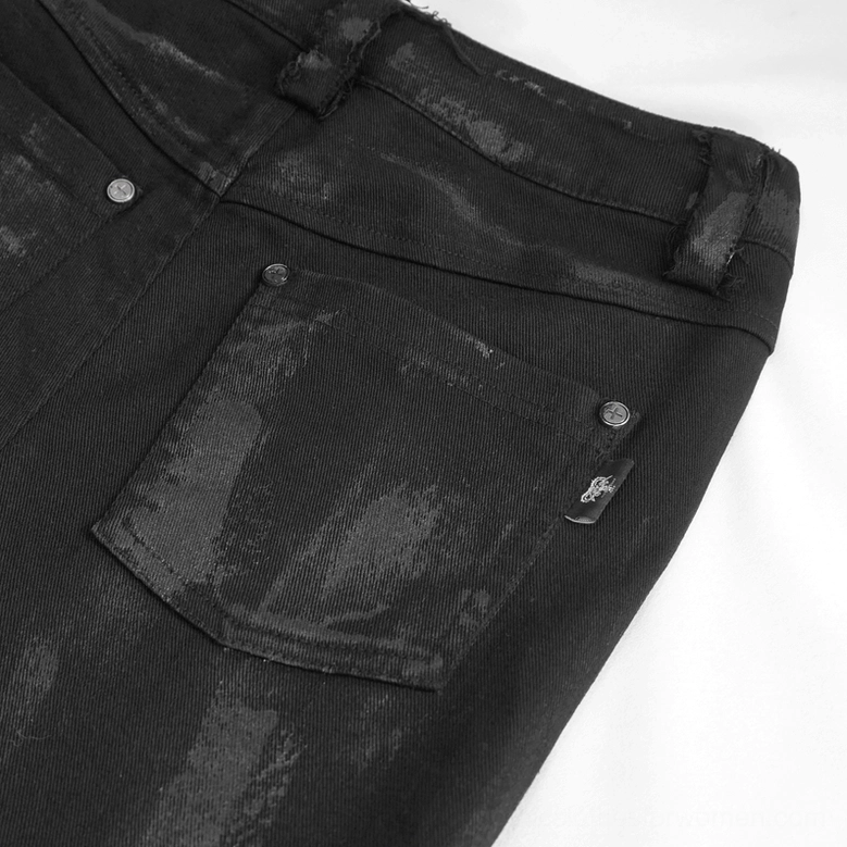 Back waist and pocket detail of black gothic punk trousers with faded coated denim finish and branded back pocket