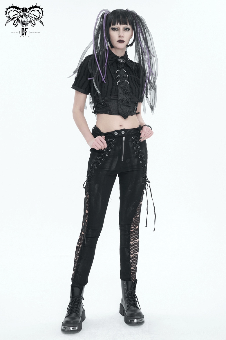 Black gothic lace-up punk trousers worn as part of complete goth aesthetic with corset top and jewelry