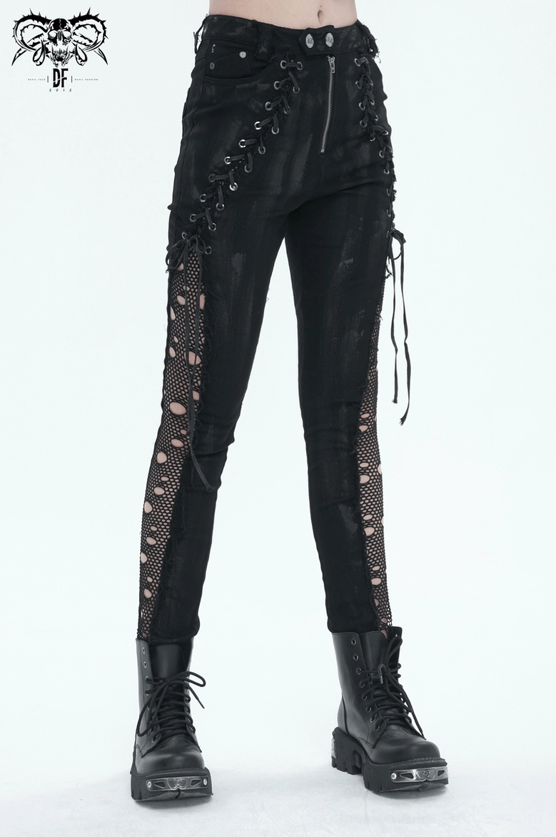 Black gothic lace-up punk trousers close-up of metal hardware and button closure mechanism