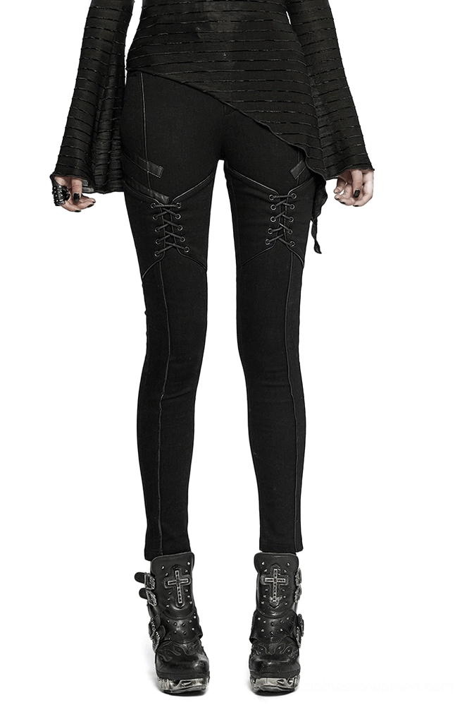 Black gothic lace-up skinny jeans front view on model, full-body display of punk-inspired women's denim with thigh lacing details