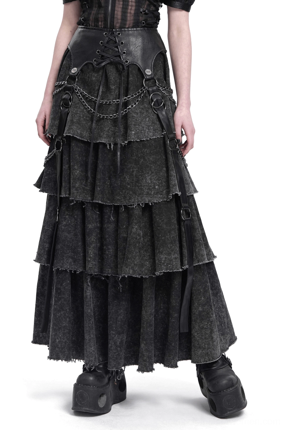 Black layered gothic maxi skirt with chain straps worn by model showing full front silhouette with tiered ruffles and distressed edges