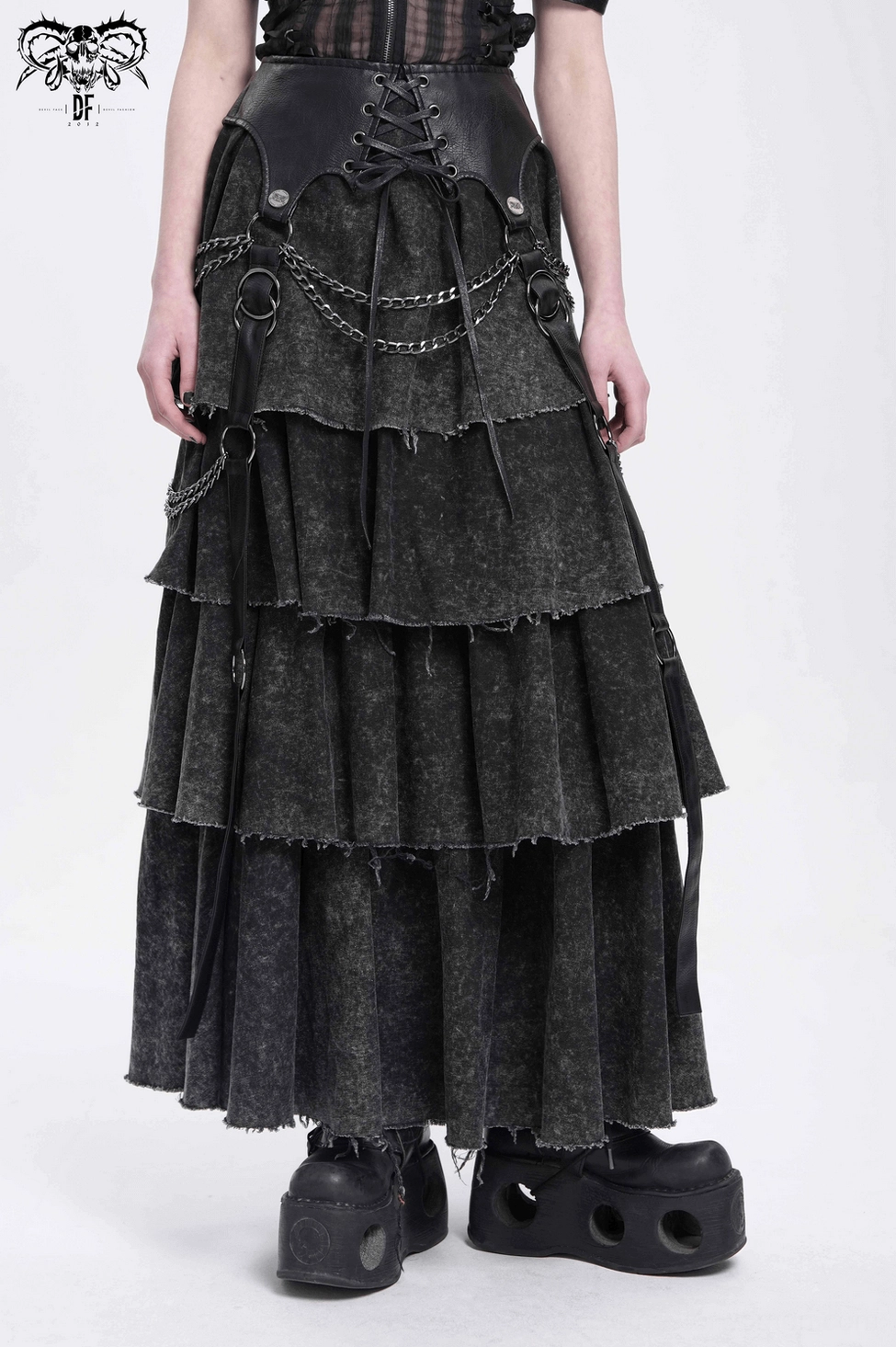 Black gothic layered skirt showing complete front silhouette with all chain and lace-up details visible