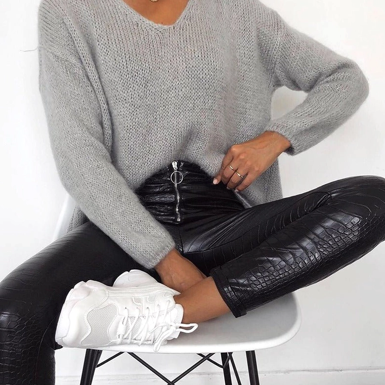 Black high-waist gothic faux leather pencil pants full-body model shot, showing overall silhouette, fit, and texture in natural indoor lighting