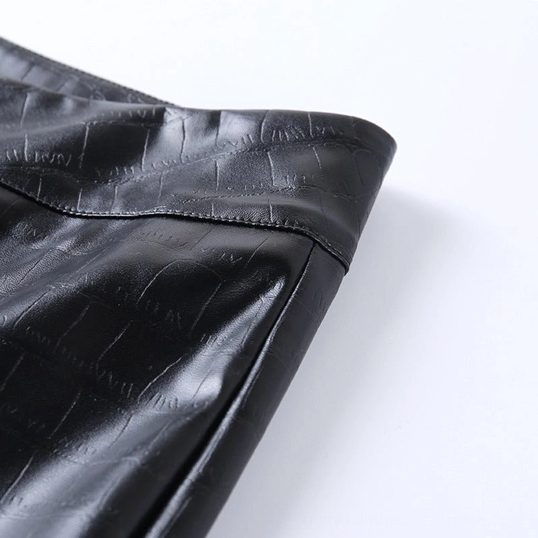 Black high-waist gothic faux leather pencil pants worn on model, detail view of waist area and zipper closure mechanism