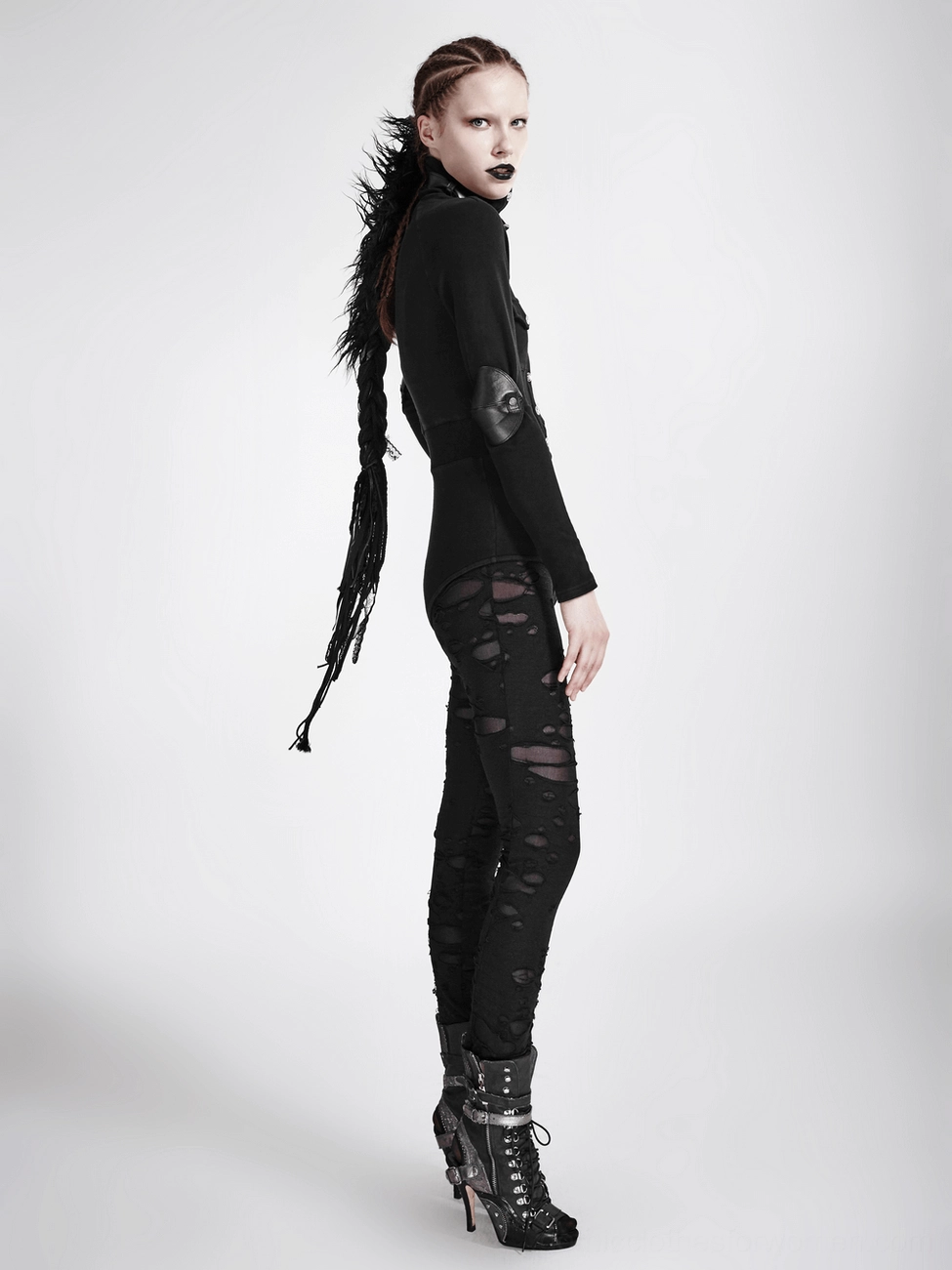 Black ripped mesh gothic leggings detail shot showcasing distressed construction quality