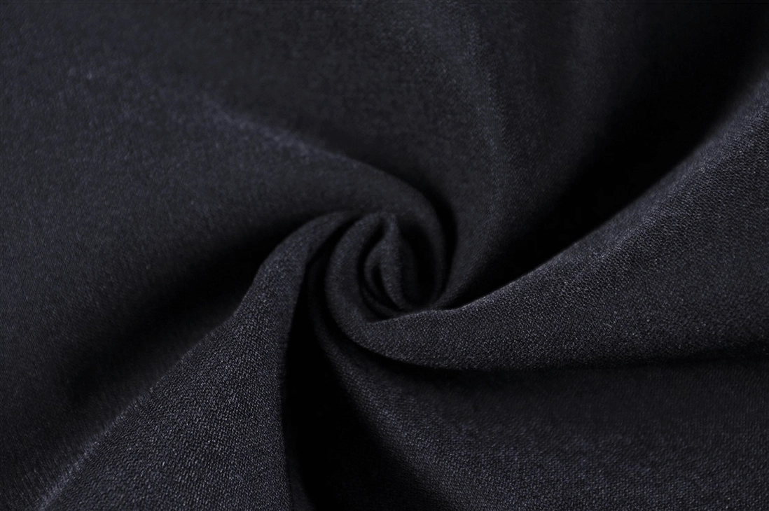 Close-up detail of black gothic leggings base fabric showing smooth matte stretch knit texture and premium material quality