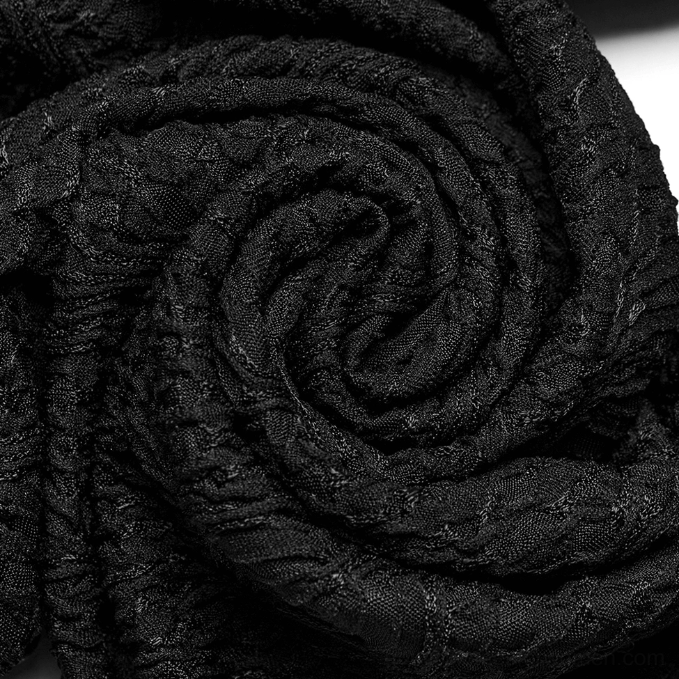 Black gothic leggings fabric detail showcasing intricate woven lace pattern and premium embossed textile surface