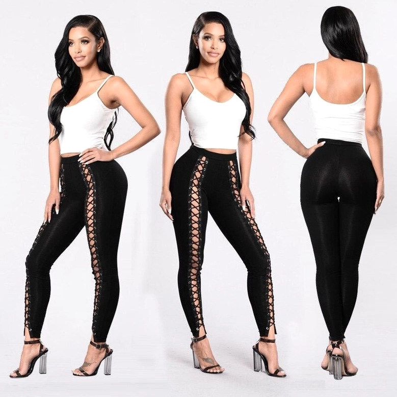 Black lace-up gothic leggings with single side hollow details, front three-quarter angle on model