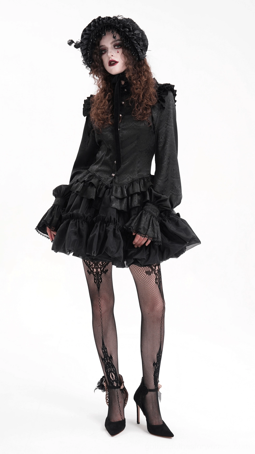 Black gothic ruffled tulle skirt showing multi-tier construction and dramatic volume characteristic of lolita fashion