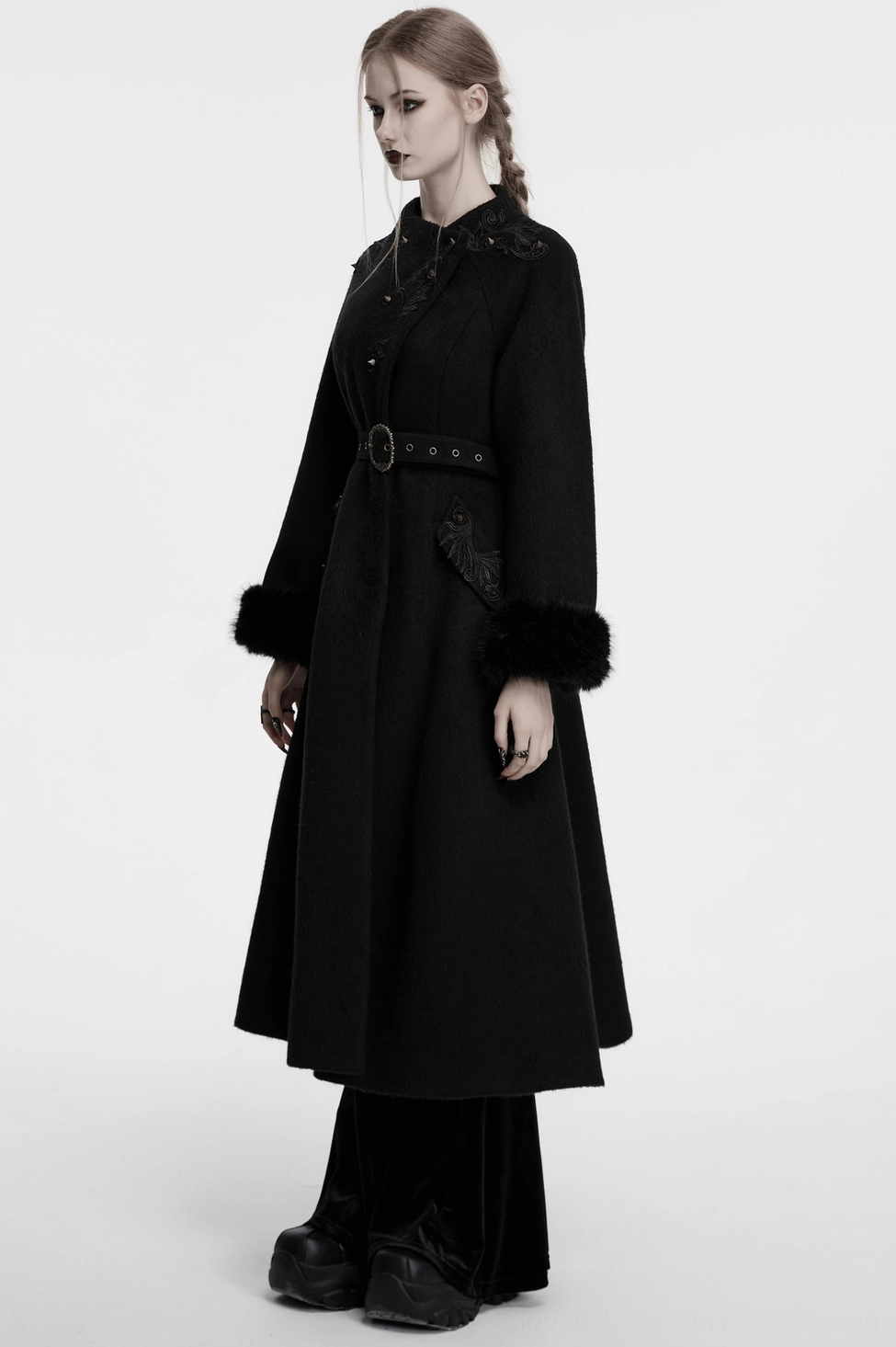 Full-length view of black gothic long coat in fitting silhouette, emphasizing Victorian-inspired tailoring and goth aesthetic