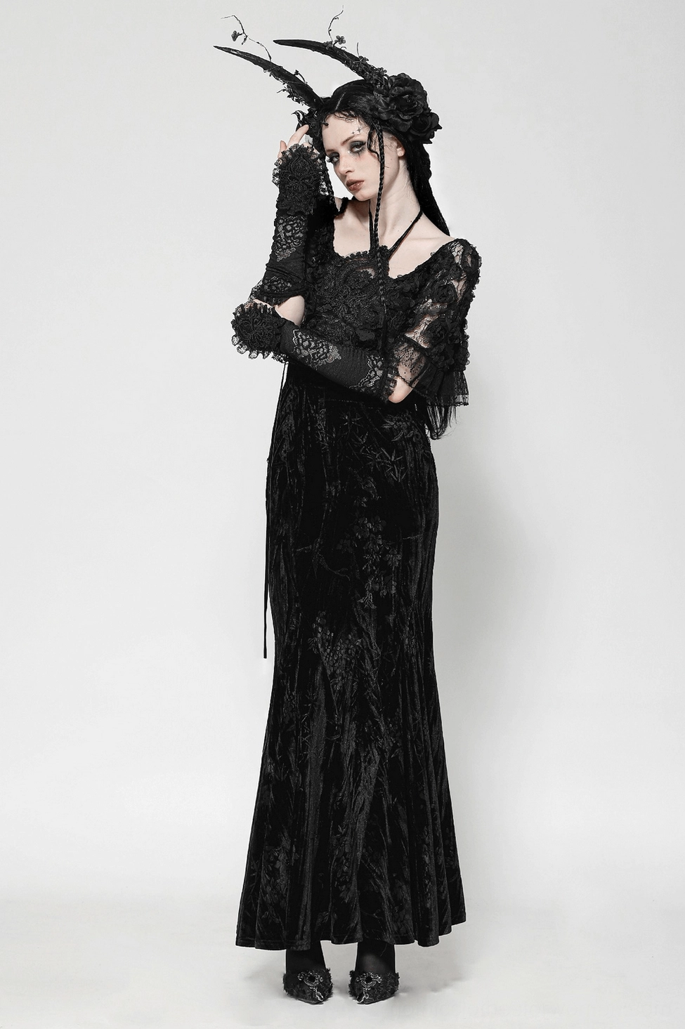 Black gothic maxi dress alternative fashion styling with lace details and halter neckline