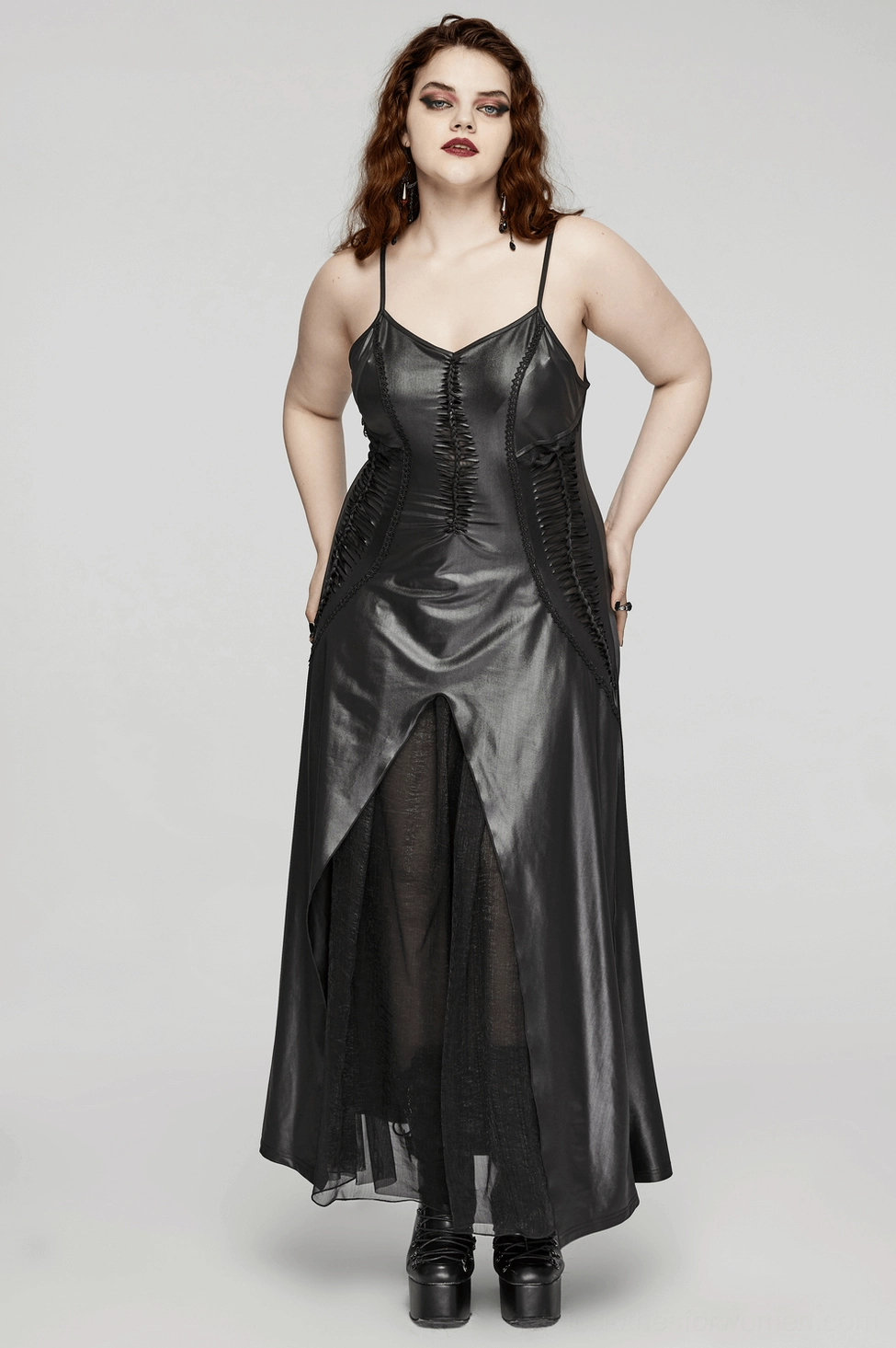 Black gothic maxi dress with flowing floor-length hem and lace-up back detail in studio photography