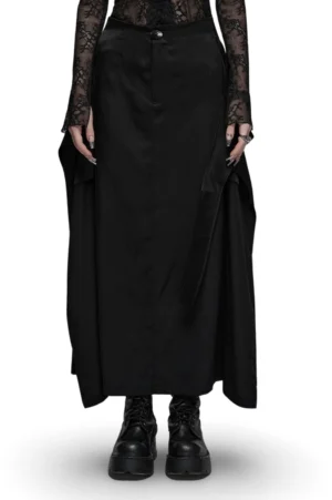 Black gothic A-line maxi skirt with metal brooch front view on model, Victorian-inspired design with rear slit