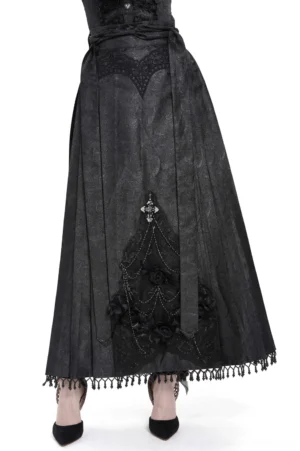 Black gothic maxi skirt with silver cross lace and rose chain details, front view on female model with black heels