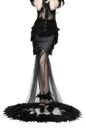 Black gothic maxi skirt with feather-trimmed mesh train worn by model in front view, showcasing full-length silhouette with platform heels