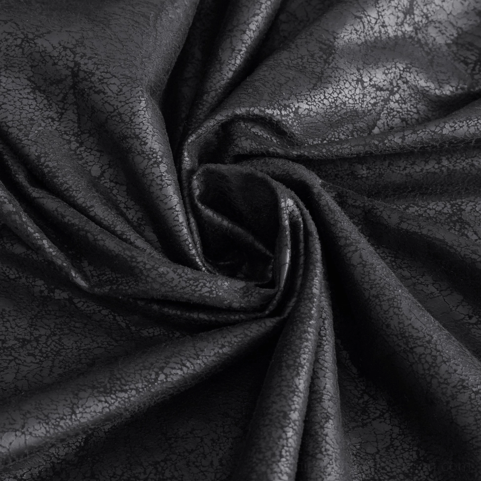 Black gothic maxi skirt flat lay displaying the comprehensive buckle strap system and structured A-line silhouette that commands attention