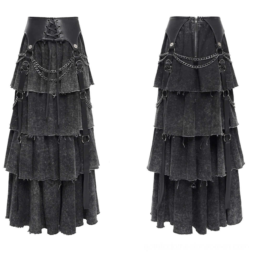 Flat lay front view of black gothic skirt showing lace-up waist panel leather detail with silver hardware and chains