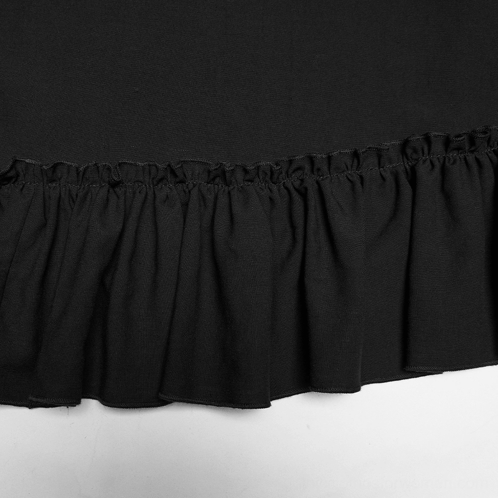 Close-up detail of black gothic maxi skirt gathered ruffled hem with textured lace trim
