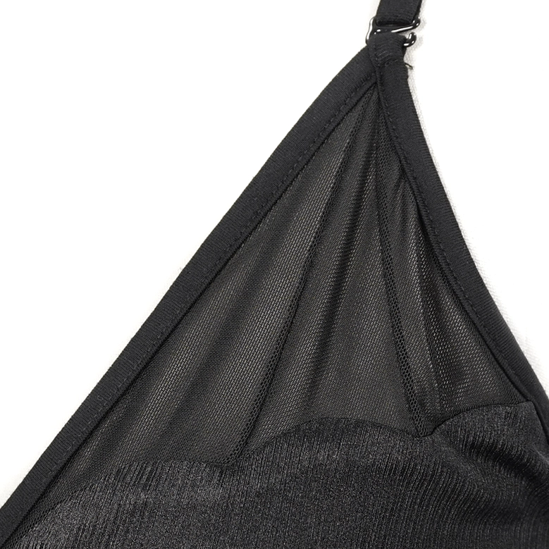 Close-up of black gothic mesh bikini fabric texture showing sheer mesh and solid stretch material contrast