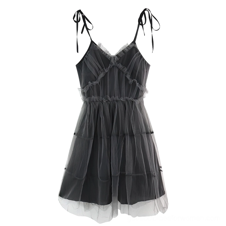 Flat lay of black gothic tulle mini dress showing tiered mesh ruffles, hidden inner lining, and adjustable tie straps