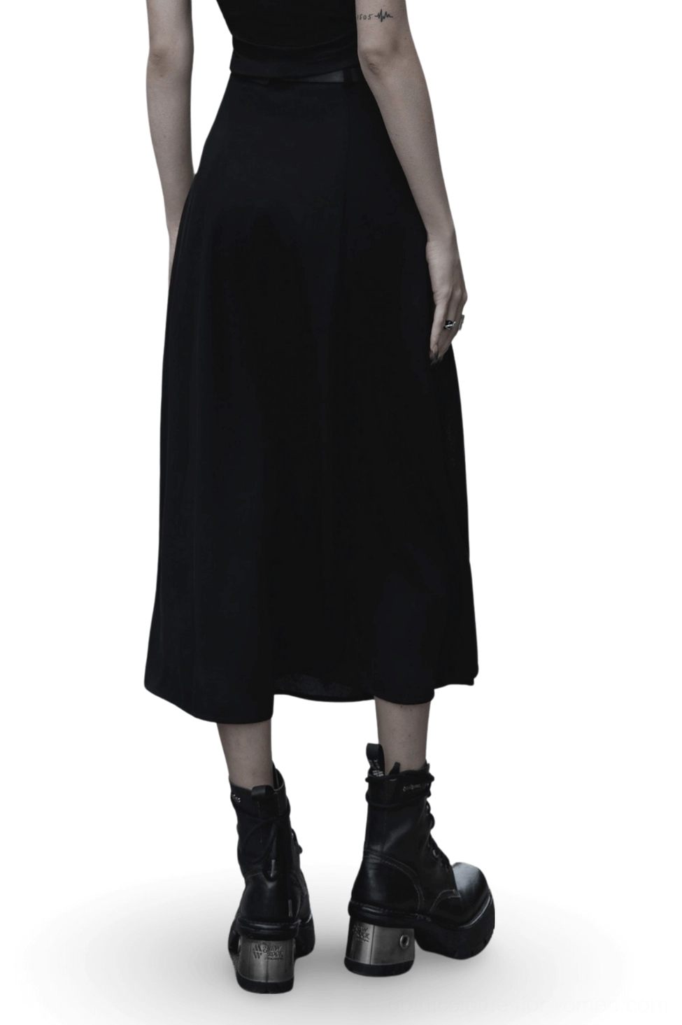 Black gothic midi skirt rear view showing smooth matte chiffon fabric and matching leather waist belt on model in white studio setting