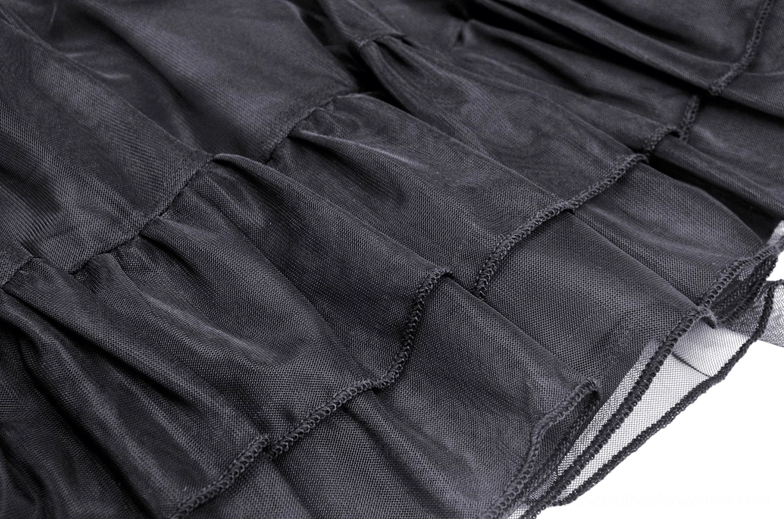 Black gothic mini skirt styled with alternative fashion accessories and dark aesthetic elements