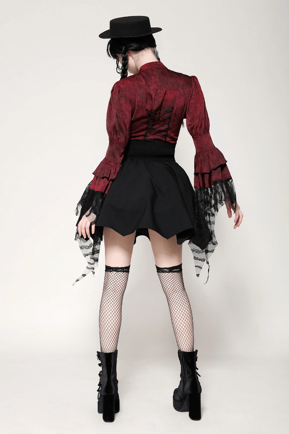 Full black gothic mini skirt with asymmetrical bat wing hem product photography