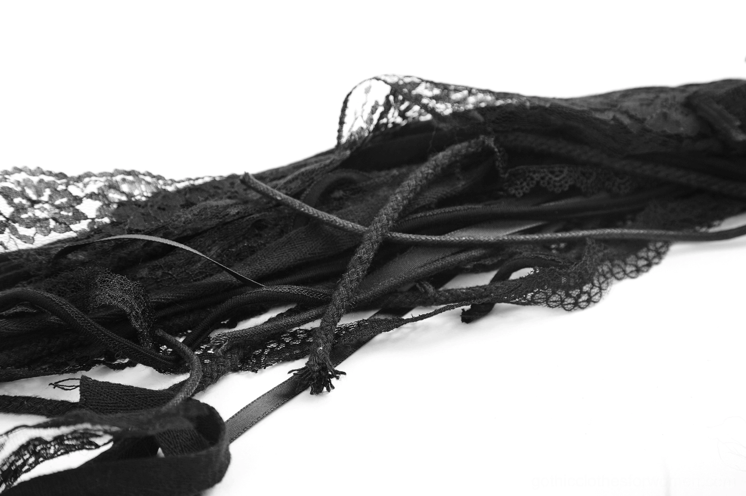 Top-down flat lay of black goth mohawk hair accessory showing full length faux fur trailing piece and lace elements