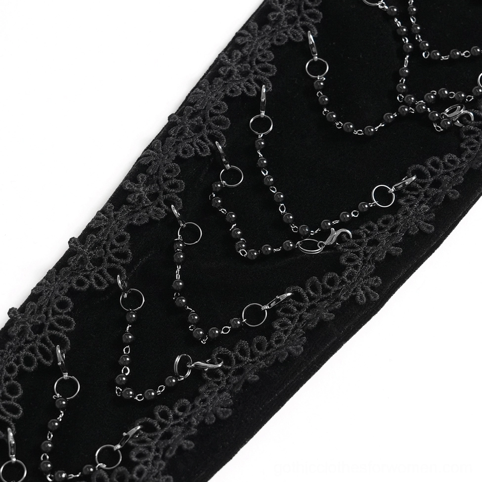 Black gothic opera gloves product shot emphasizing the luxurious velvet texture, metal chain details, and elegant lace cuff embellishments