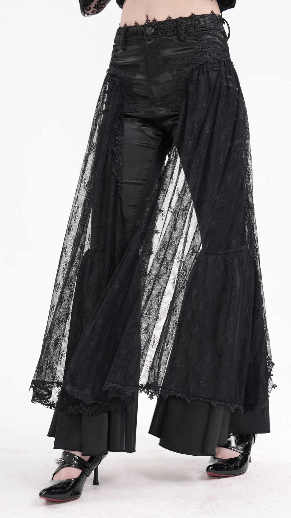 Complete styling shot of black lace gothic bell-bottom pants as part of alternative fashion goth ensemble