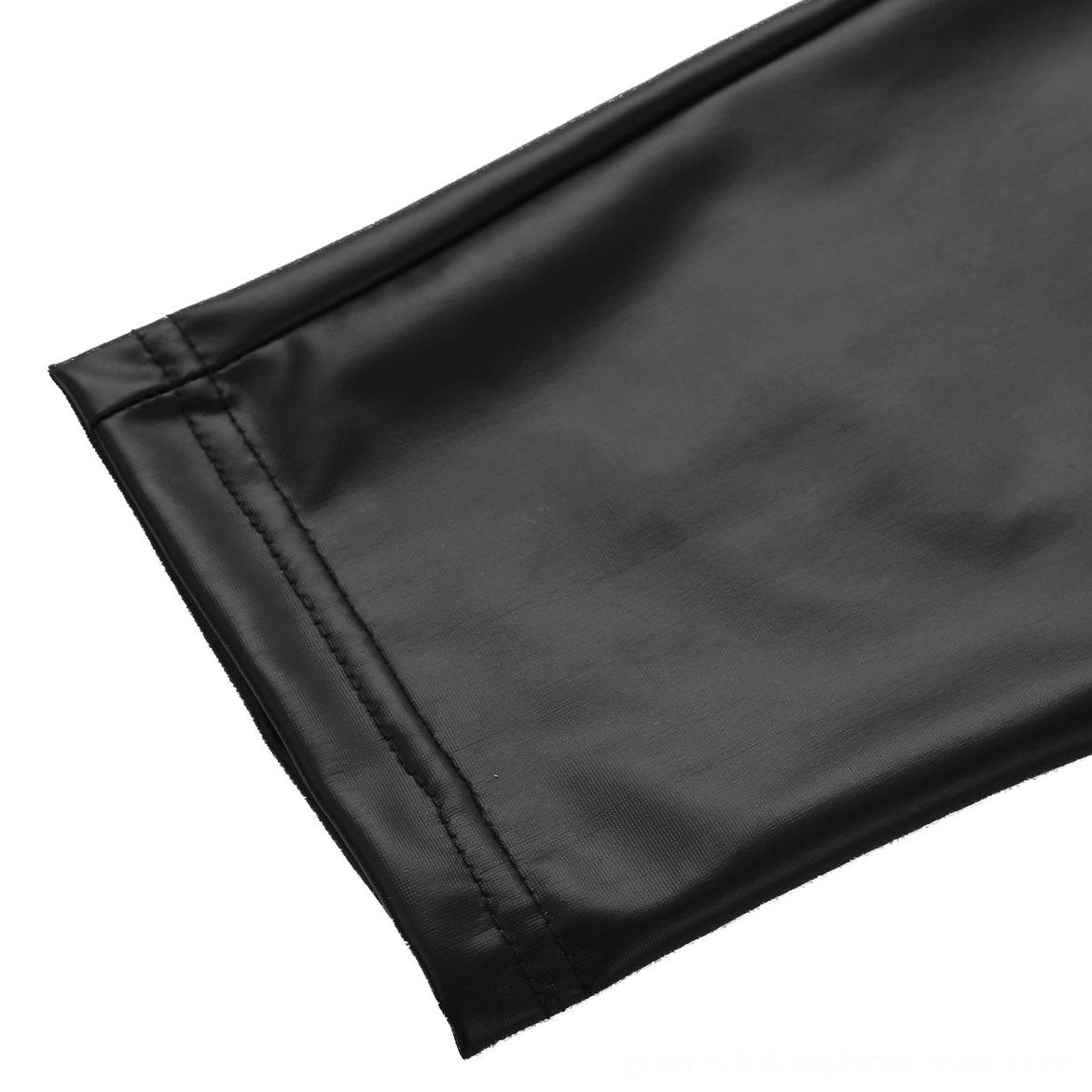 Close-up detail of black faux leather gothic pants hem and ankle, showing smooth leather texture and professional stitching finish