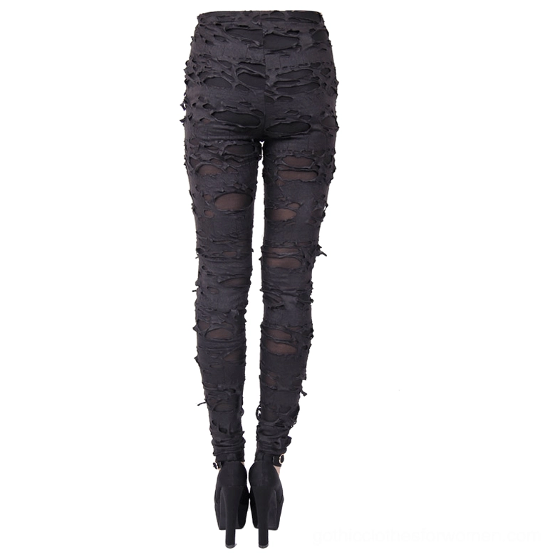 Rear flat lay of black skinny tattered gothic pants with high waist cut and sheer mesh underlayer