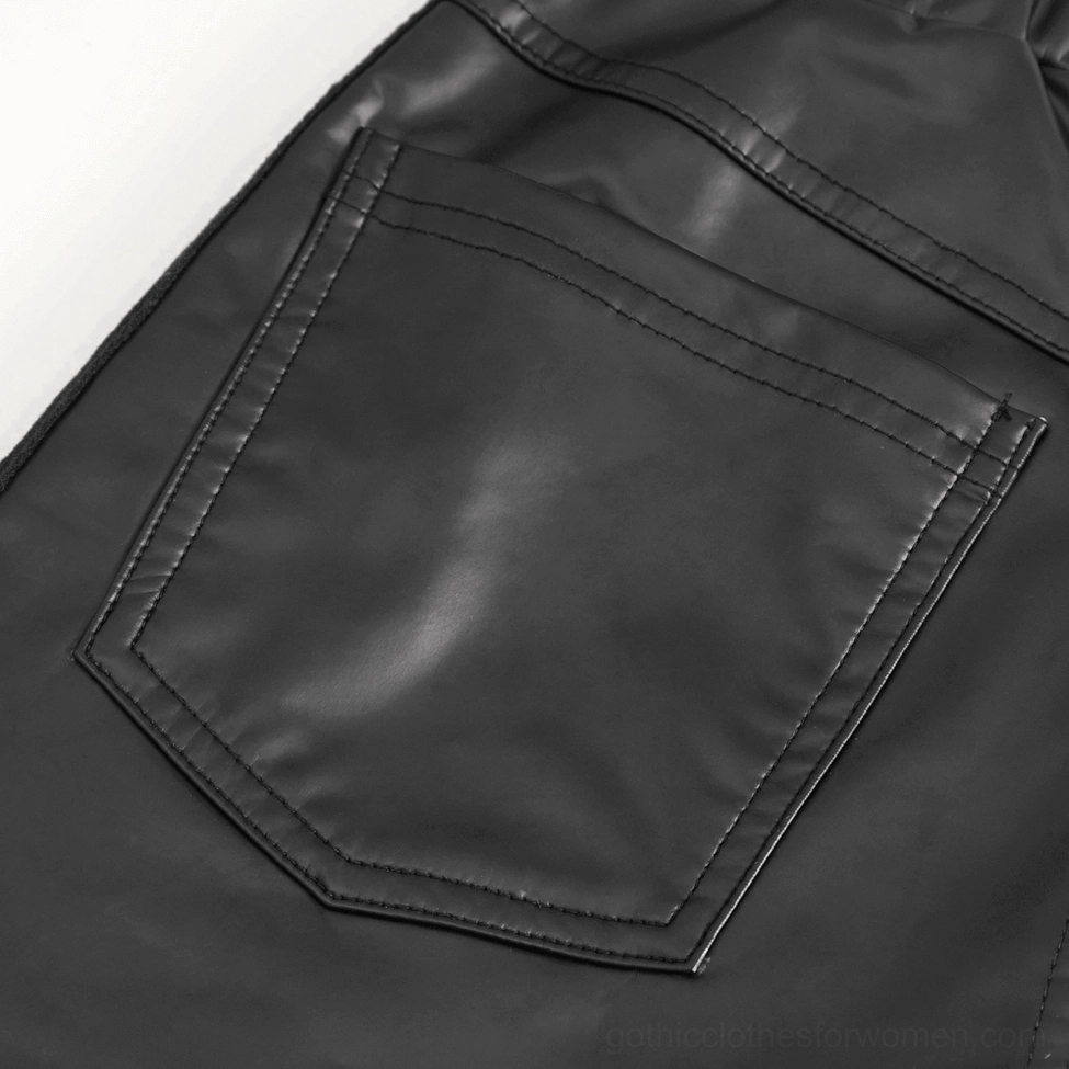 Gothic faux leather pants showing seam construction and chain placement details