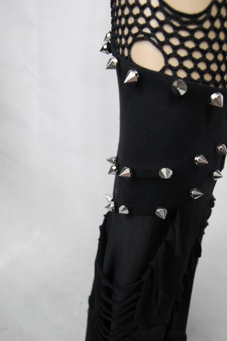 Shredded mesh and spike stud trim detail on black gothic trousers