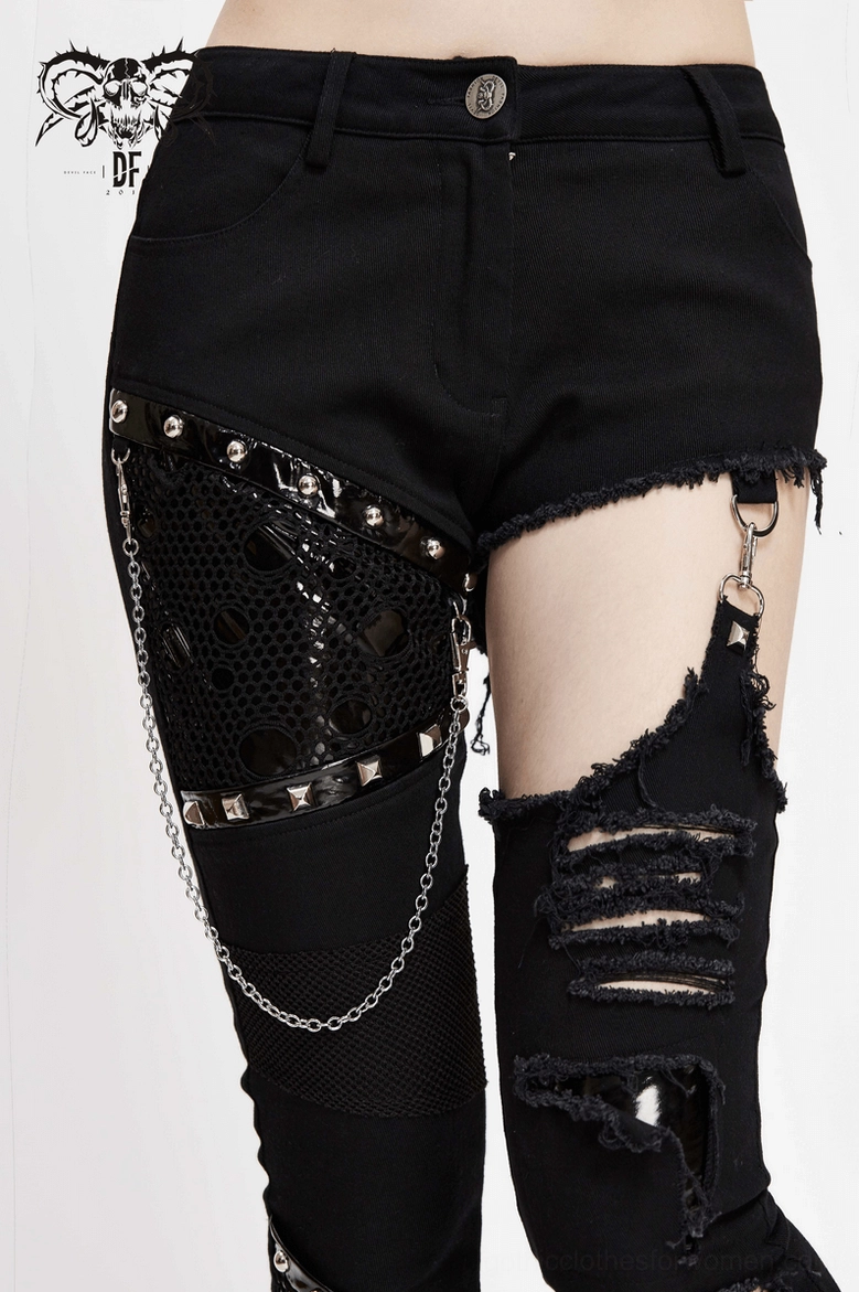 Black gothic asymmetrical pants with chain hardware and ripped design, styling detail view