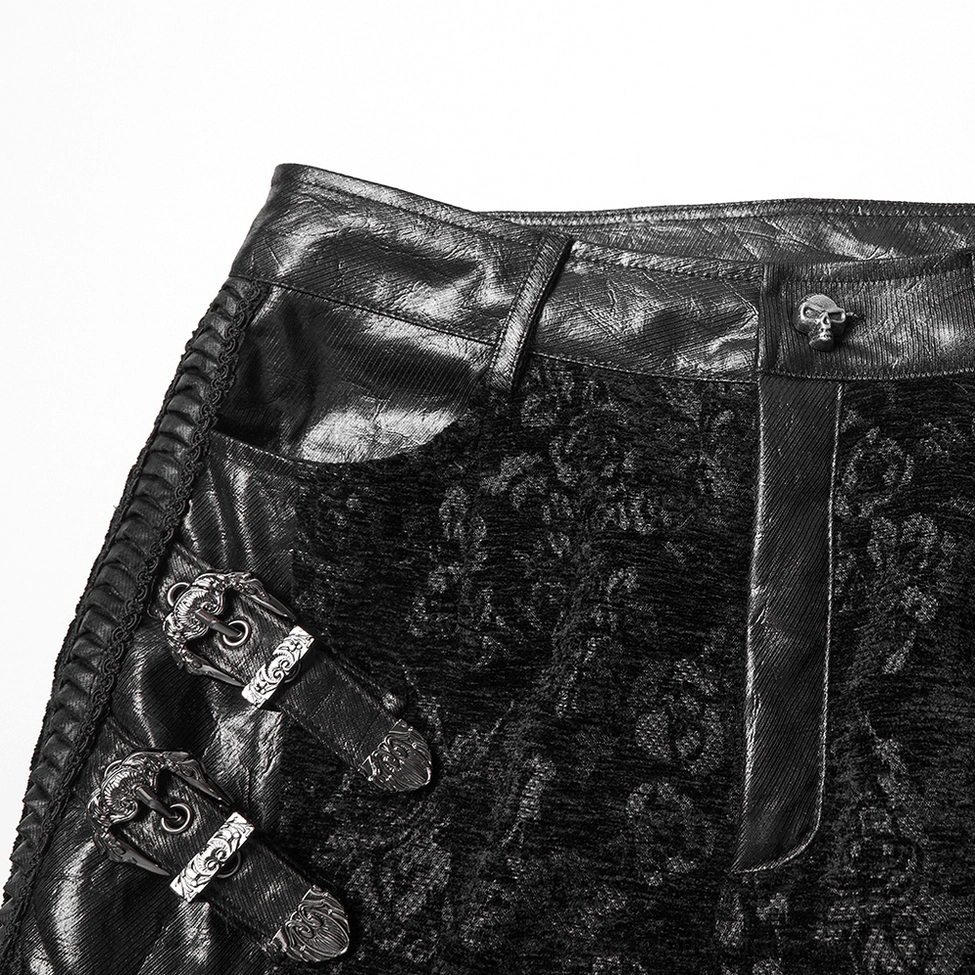 Black gothic pants waist close-up - skull-shaped button, faux leather waistband, vintage metal buckles and hardware