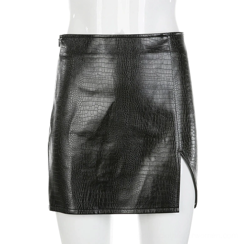 High-waist black croc PU leather mini skirt displayed on white mannequin, fitted silhouette with side slit detail