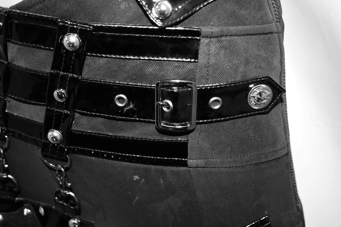Back panel of black gothic pentagram pants showing rear pocket and lace-up waist construction