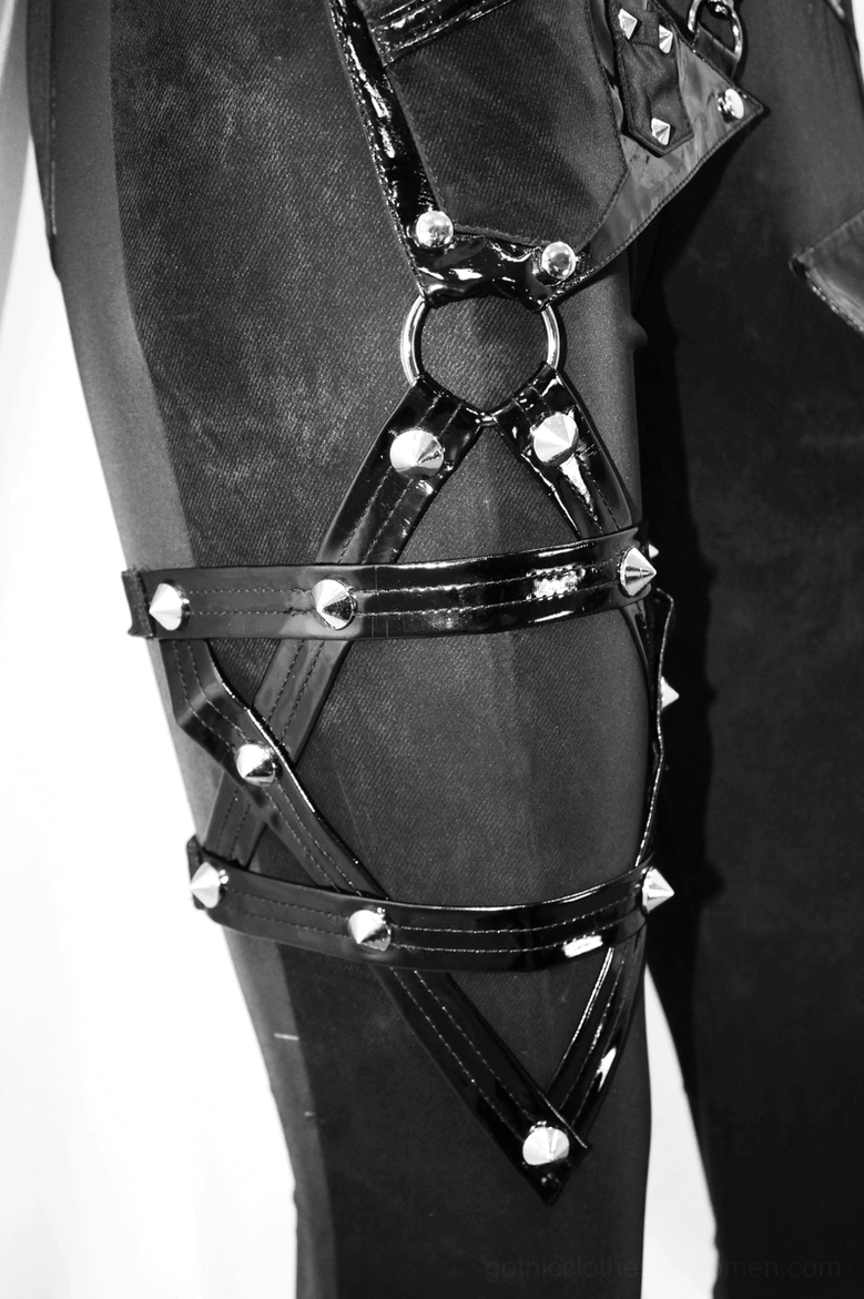 Waistband and harness system detail of black gothic pentagram pants with chainwork trim